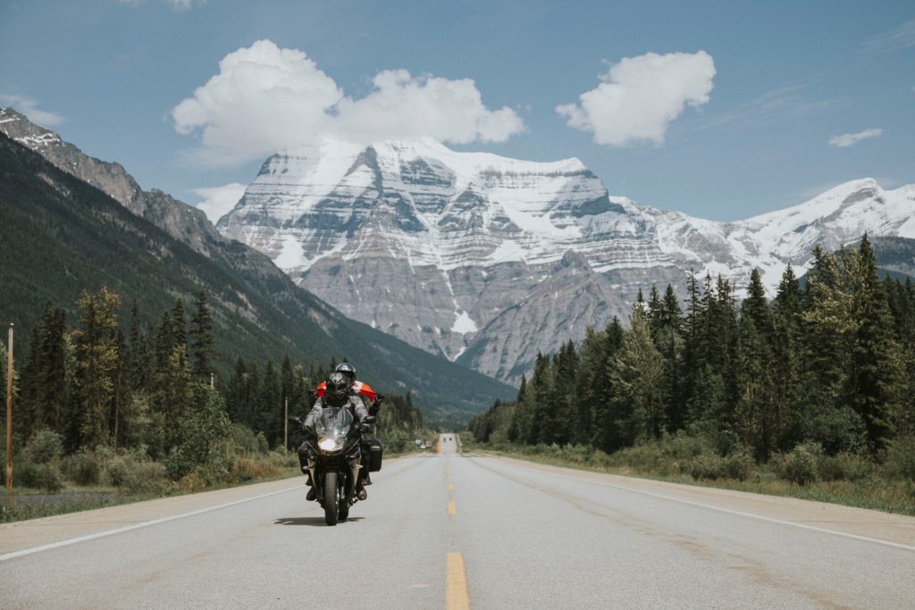 Motorcycle riding on Route 16 with Mount Robson in the background