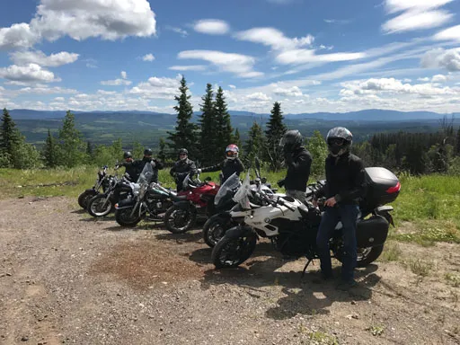 Local Smithers riders on their motorcycles at a lookout point along route 16