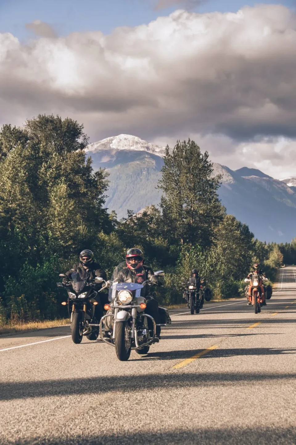 motorcyclists on route 16 riding from terrace to prince rupert along the skeena river